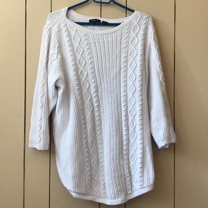 White 3/4 sleeve knitted shirt.
